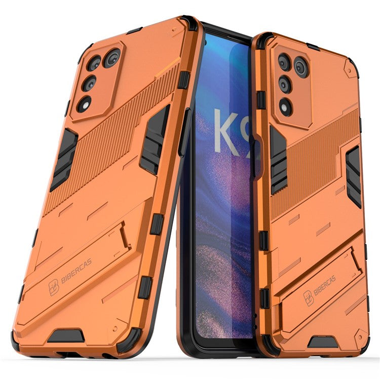 Scratch-resistant Drop-proof Soft TPU Hard PC Back Cover Shell with Kickstand for Oppo K9s 5G - Orange